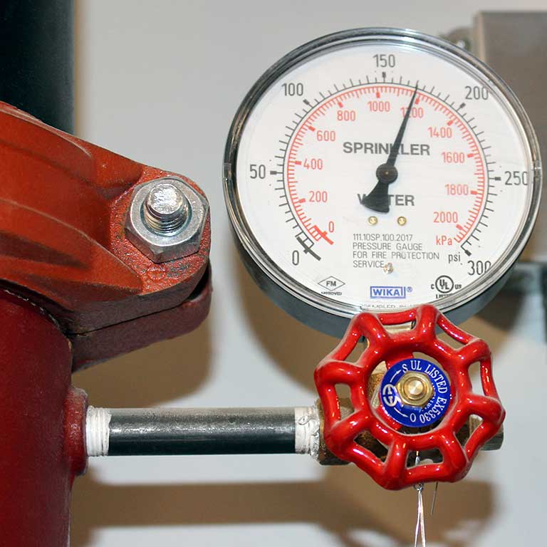 A fire suppression sprinkler system pressure gauge